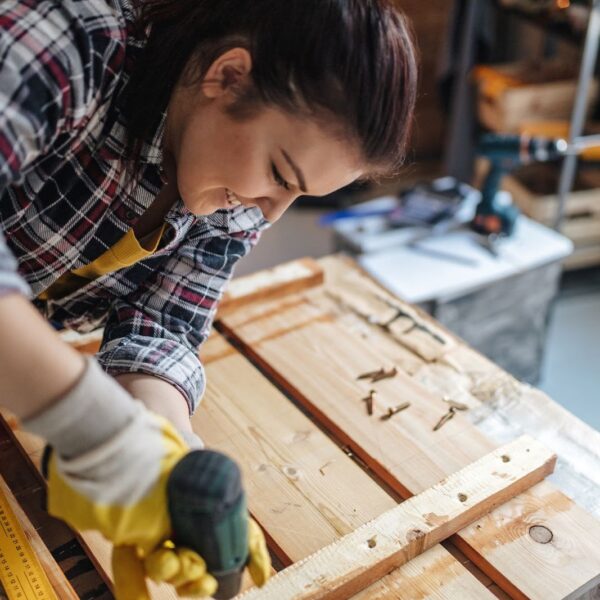 Woman Drilling Box Together