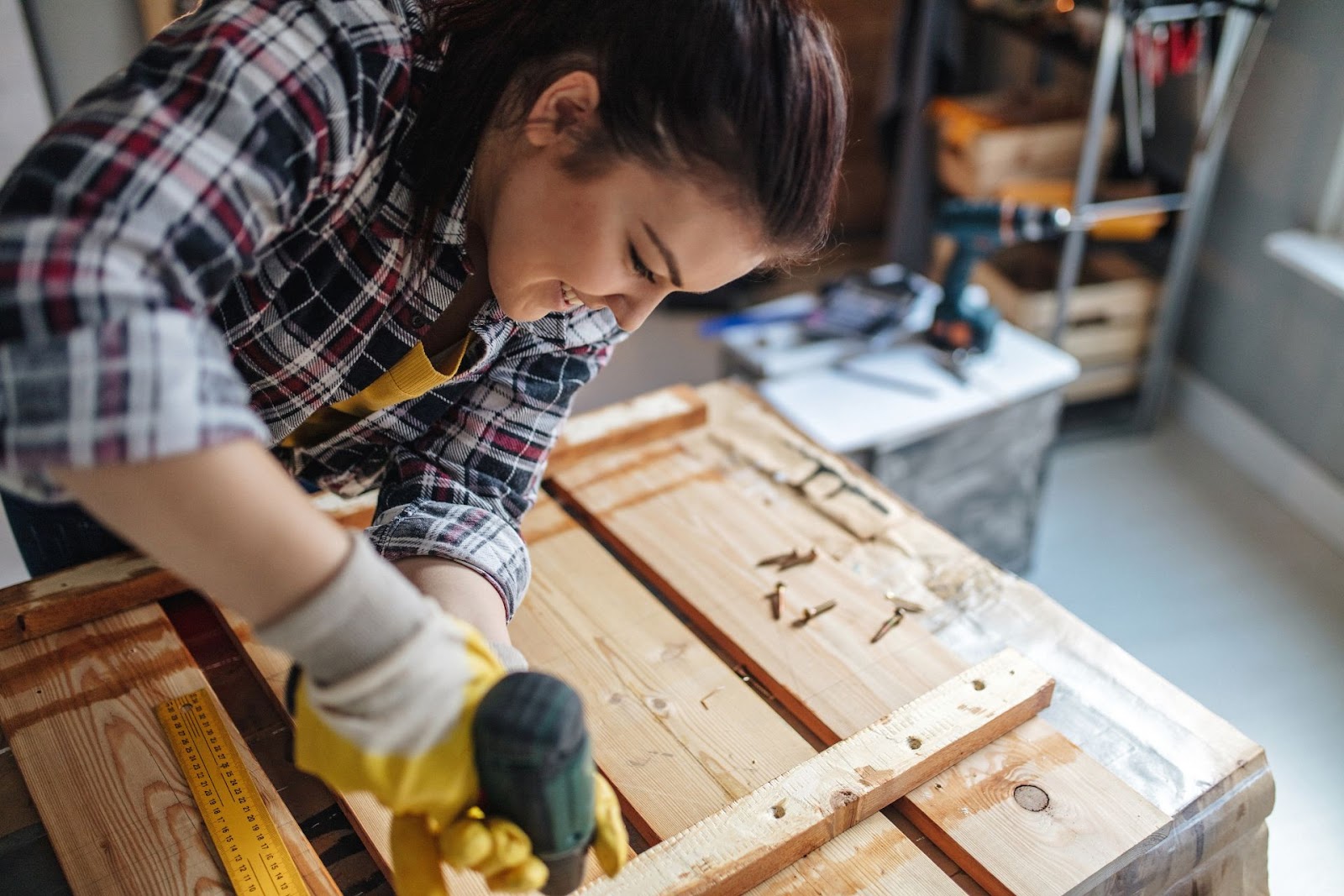 Woman Drilling Box Together